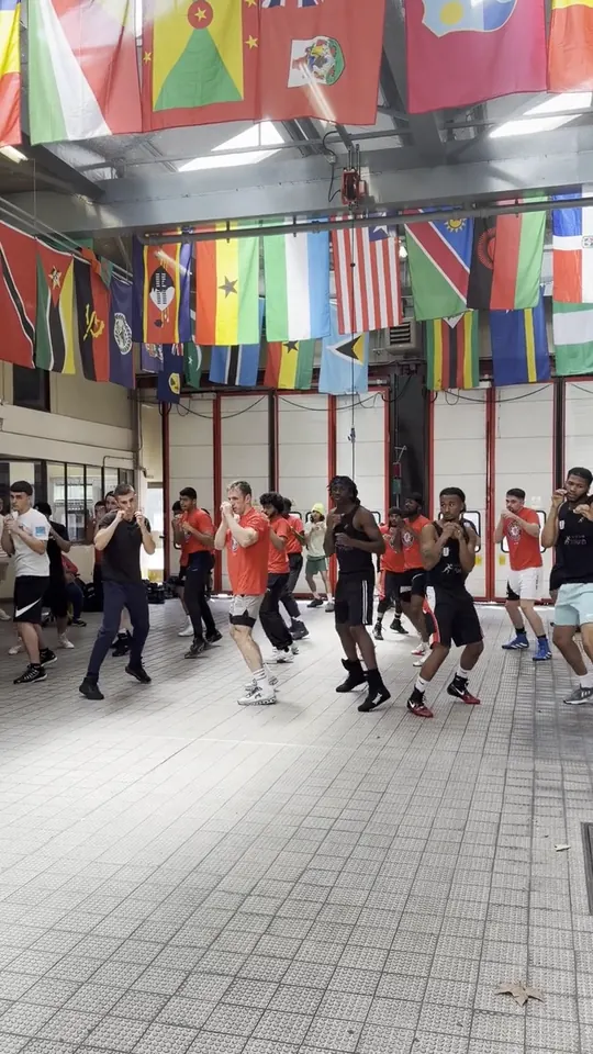 Video of a firefighter joining the group footwork drill beneath the flags