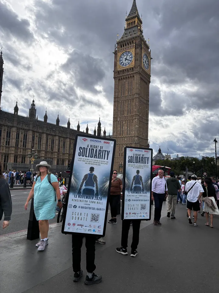 Campaign boards for A Night of Solidarity carried beneath Big Ben