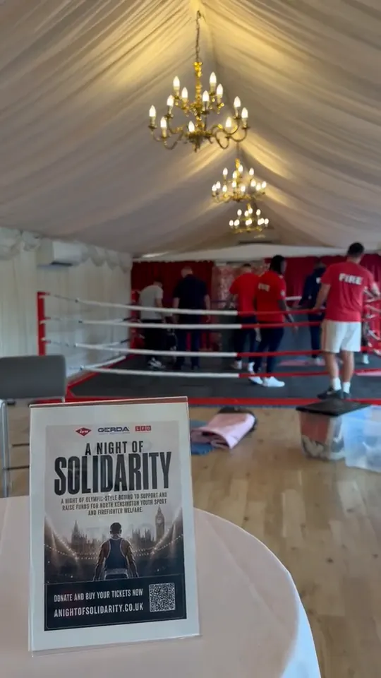 Video of an A Night of Solidarity poster, with boxers standing in the ring behind